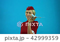 The stewardess smiling with a toy plane in her hands 42999359