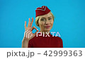 The stewardess shows that everything is in order 42999363