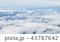 Aerial view of clouds hrough airplane window 43787642