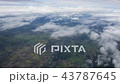 Aerial view of clouds through airplane window 43787645