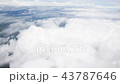 Aerial view of clouds hrough airplane window 43787646