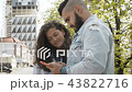 Stylish young couple in love using smartphone 43822716