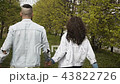 Casual couple holding hands in park 43822726