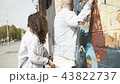 Playful couple on street in sunlight 43822737