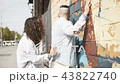 Playful couple on street in sunlight 43822740