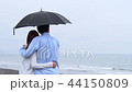 Couple umbrella facing back left Couple umbrella facing back left 44150809