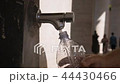 male watering bottle from the water source fontanella Vatican close-up 44430466