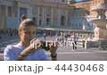 girl does a photo on the central square of the Vatican Piazza San Pietro 44430468