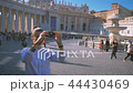 girl does a photo on the central square of the Vatican Piazza San Pietro 44430469