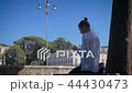 girl uses a smartphone on Piata di Popolo in sunny Rome 44430473