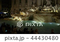 Crowd of people with photo cameras and smart phones near the Trevi fountain in Rome in the evening 44430480