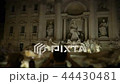 The crowd in front of the Trevi Fountain, a man shoots a fountain on the smartphone Rome night 44430481
