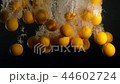 Orange Drops Under Water on Black Background. Fresh Orange Fruit Plunging And Splashes Water. Water 44602724
