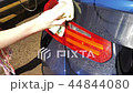 Blue sedan car washing in the sink 44844080