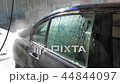 Blue sedan car washing in the sink 44844097