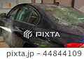 Blue sedan car washing in the sink 44844109
