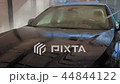Blue sedan car washing in the sink 44844122