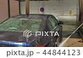 Blue sedan car washing in the sink 44844123