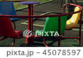Roundabout merry go round spinning on empty playgr 45078597