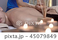 Attractive Man Having a Great Back Massage Body Treatment in Beauty Spa Center 45079849