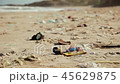 Horrid sandy sea shore full of litter and garbage on a sunny day in spring 45629875