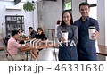 Baristas showing a cup of coffee. 46331630