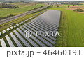 drone aerial of a solar power plant next to the highway in agricultural landscape 46460191
