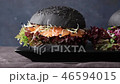 Two homemade black burgers with salted salmon 46594015