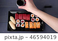 Sushi set nigiri and rolls on black plate 46594019