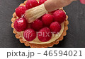 Unfinished to eat tartlet with custard raspberries 46594021