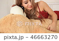 Blond woman wake up in the morning and hug big huge teddy bear 46663270