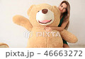 Blond girl hug big huge teddy brown bear and wave hand 46663272