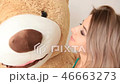 Happy beautiful girl hug huge teddy bear 46663273