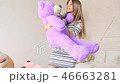 Happy beautiful woman hug teddy bear 46663281
