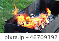 Burning wood in fire on grill place 46709392