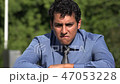 Sad Hispanic Man 47053228