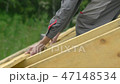 the worker is building the roof 47148534