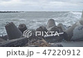 Waves breaking on concrete breakwaters. Sea storm. 47220912