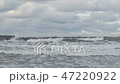 Waves breaking on concrete breakwaters. Sea storm. 47220922