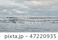 Waves breaking on concrete breakwaters. Sea storm. 47220935