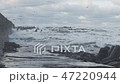 Waves breaking on concrete breakwaters. Sea storm. 47220944