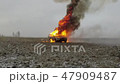 Car Explosion, Front View, Car burns in a gray fiel 47909487