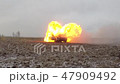 Car Explosion, Front View, Car burns in a gray fiel 47909492