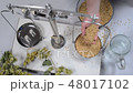 Home brewing of beer. Man weighs barley.  View fro 48017102