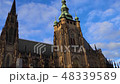 Camera reveals old gothical cathedral of Saint Vitus in Prague castle during sunset historical 48339589