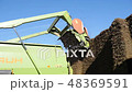 Tractor cuts hay on a farm 48369591