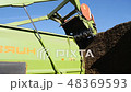 Tractor cuts hay on a farm 48369593