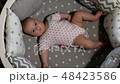 Newborn baby. Little baby. Child. Adorable baby girl. Baby in crib. Baby in bed 48423586