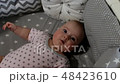 Newborn baby. Little baby. Child. Adorable baby girl. Baby in crib. Baby in bed 48423610