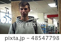 Man at the sports store explains something 48547798